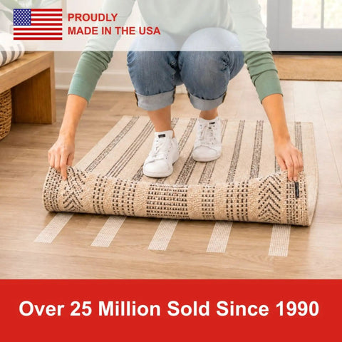 Person applying Double Sided Non Slip Carpet Tape For Area Rugs And Runners That Delivers A Residue Free Long Lasting Bond on a rug