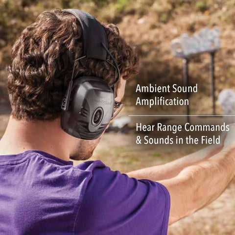 Person wearing Impact Pro Electronic Earmuff With NRR 30 for shooters amplifies ambient noise up to 4x outdoors.