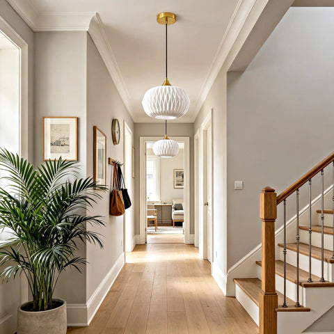 Vaziden Milk Glass Pendant Lights Kitchen Island Gold Chandelier 11.81" hanging in a modern hallway with plants and decor.