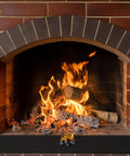 9x12 Inch Heavy Duty Heat Shield Barrier Blanket With Reflective Insulation Carbon Felt in front of fireplace with flames