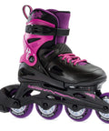 Black and pink junior adjustable inline skate for fitness with breathable molded boot, push button size adjustment and secure closure.