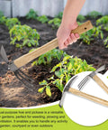 Person using 2 Piece Garden Hoe Tools Set with 15 Inch Carbon Steel Cultivator Hand Tiller and Hand Pick Axe in garden