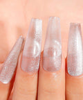 Close-up of silver glitter nail art using Cat Eye Gel Nail Polish Set HEMA Free Cruelty Free Vegan Soak Off UV LED Gel Manicure Kit.
