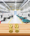 Pipe Fitter Flange Alignment Pin Set 1-1/8 Inch Two-Hole Dowel Pins in a workshop, gold finish on wooden surface