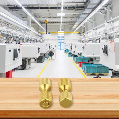 Pipe Fitter Flange Alignment Pin Set 1-1/8 Inch Two-Hole Dowel Pins in a workshop, gold finish on wooden surface