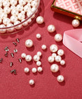 Pearl rivet stud set for clothing and accessories; 150 faux pearls in multiple sizes with metal posts, front view