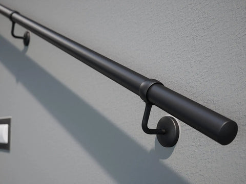 Rock Solid Steel Staircase Handrail Six And A Half Feet Long No Sweat Wall Mount Indoor Safety Railing With Grippy Matte Black Coating angled view on wall.