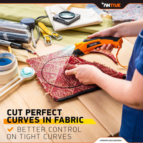 Upgrade To The Latest Antive Electric Scissors For Fabric And Cordless Cardboard Cutter With 2 Heads, Featuring A Safety Lock Button And Tungsten Steel Blades For Smooth, Effortless Cutting. Perfect For Diy Projects. in use, cutting fabric with tight curves.
