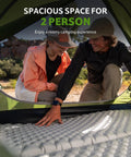 Two people inside Bleik-A 2 To 3 Person Camping Tent With Waterproof Double Layer, spacious interior visible through front opening