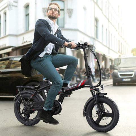 Peak 500W Step Through Fat Tire Electric Bike With 48V Removable Battery For Easy Recharges And Long Rides Up To 40 Miles 7 Speed LCD Display Sixteen Inch By Three Inch Fat Tire For City Cruisin And Trail Ridin., man riding black step-through fat tire electric bike on city street