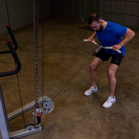 User performing curls with Straight Up Heavy Duty Aluminum Curl Bar Attachment Compatible With Cable Machines in home gym.