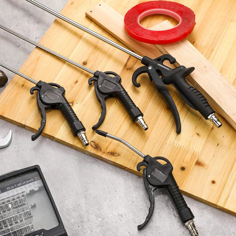 Heavy Duty 4 Piece Air Blow Gun Kit With Angled Aluminum Nozzles And Slick Pistol Grip To Blast Off Dust And Chips Fast For Auto Detailing Crew Or Local Shop on a wooden surface.
