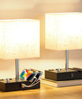 Set Of 2 Dimmable Beige Bedside Lamps With USB C Ports And Dual Charging Outlets on wooden bases with phone stands