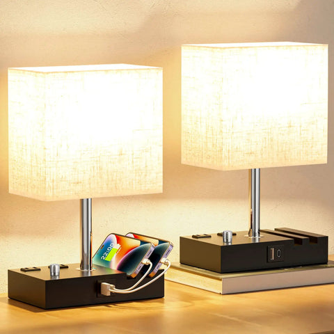 Set Of 2 Dimmable Beige Bedside Lamps With USB C Ports And Dual Charging Outlets on wooden bases with phone stands