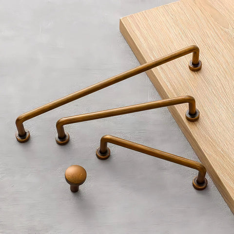 Vintage Antique Brass Drawer Pulls 10 Piece Set For Cabinets And Vanities displayed on wooden surface