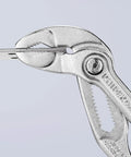 Cobra Water Pump Pliers Chrome With One Handed Adjustment And Guard gripping metal, showing hardened teeth and fine adjustment.