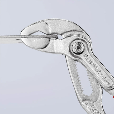 Cobra Water Pump Pliers Chrome With One Handed Adjustment And Guard gripping metal, showing hardened teeth and fine adjustment.