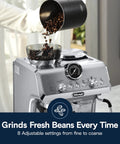 Compact Espresso Machine With Built In Burr Grinder And Milk Frother For A Home Barista Kit with coffee beans being poured