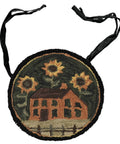Round Chair Pad Featuring House And Sunflowers Folk Art Design with black ties and plush texture, perfect for kitchen seating.