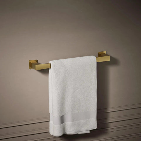 Honesty 18 Inch Towel Bar In Vibrant Brushed Moderne Brass, Modern Bath Hardware With Solid Metal Construction, holding a white towel