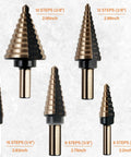 Five titanium step drill bits with markings, part of Six Piece Step Drill Bit Set With Automatic Center Punch Titanium HSS Coated Unibits Fifty Sizes For Metal And Aluminum Includes Durable Aluminum Case High Speed Cutting For DIYers.