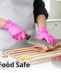 Top Tier Disposable Nitrile Gloves In Bright Fuchsia, Powder Free Latex Free, 3 Mil Flexible Grip For Kitchen Cleaning And Beauty Tasks, 100 Count Lowkey Essential Pick being used while preparing food.
