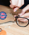 Tiny But Mighty Six Piece Magnetic Micro Precision Screwdriver Kit used for glasses repair on wooden table
