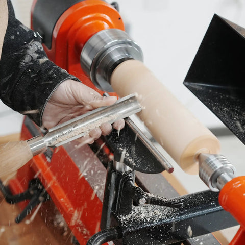 Craftsperson using a wood lathe with Two Pack One Inch And Three Quarter Inch Multitooth Drive Centers With Spring Loaded Point For Wood Lathe Chuck Fits Most Four Jaw Chucks In Wood Turning Lathe No Hassle Center Changes.
