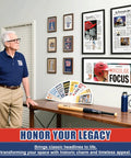 Man viewing framed newspaper front pages in Newspaper Display Frame With Premium Wood And Acrylic Panel on wall