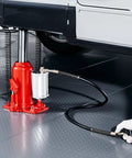 20 Ton Air Hydraulic Bottle Jack With Pneumatic And Manual Operation lifting SUV, showcasing red heavy duty design for auto repair.
