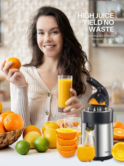 Electric Citrus Juicer With Brushed Stainless Steel Finish in use, extracting juice from fresh oranges, showcasing dual-size cups.