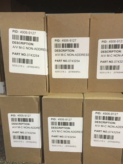 Stacked boxes labeled 4906-9127 AV Multi Candela Non-Addressable Horn Strobe Wall Mount Red Fire Alarm