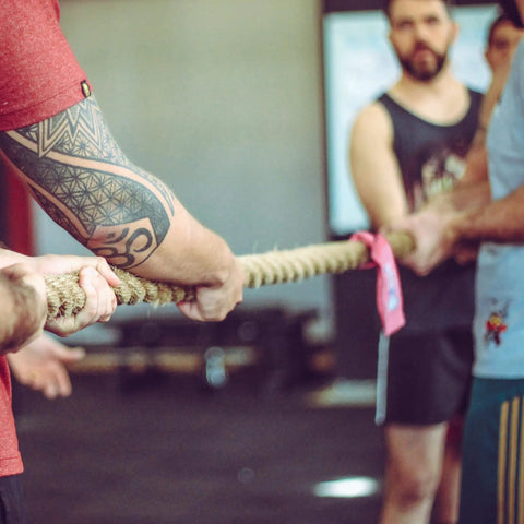 Participants pulling Natural Jute Rope 1.5 Inch Diameter 50 Feet Long Four Strand Heavy Duty during a tug of war competition.