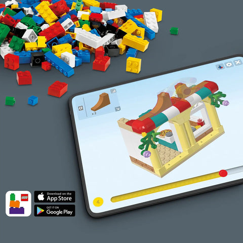 LEGO building blocks next to a tablet with LEGO model instructions, app logos displayed.