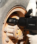 Three Quarter Inch Drive Deep Impact Socket 41 Millimeter Jumbo Metric Six Point Chrome Molybdenum Steel Black Phosphate Finish Built For Heavy Duty Impact Tools And Tough Fasteners shown in use on a large vehicle wheel