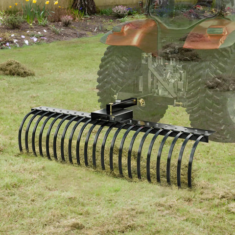 Tow Behind Landscape Rake 60 Inch Dethatcher with 21 Steel Coil Tines attached to tractor for yard cleanup.