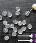 102 Count Comfort Impenetrable Soft Safety Earring Backs Made From TPE Medical-Grade Material Pacifier-Grade, shown loose and in use on earrings.