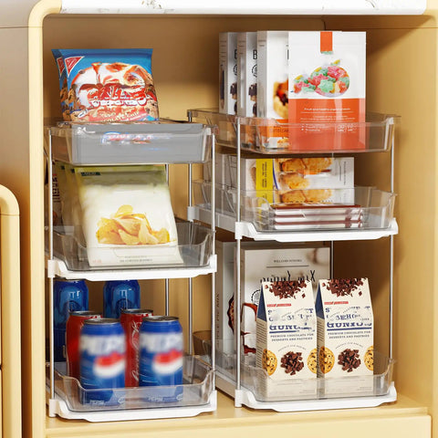 Total Game Changer Clear Three Tier Under Sink Organizer Two Pack with snacks and drinks stacked in smooth glide bins.