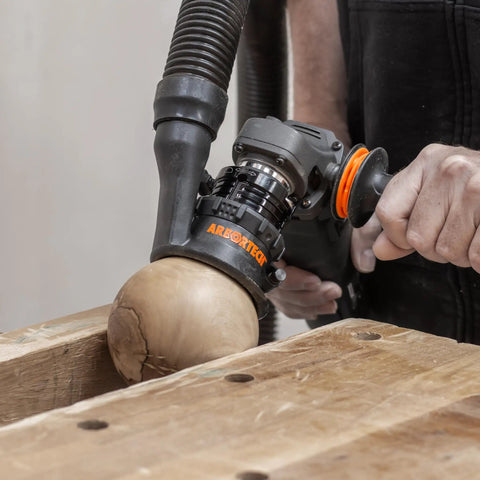 Heavy Duty Power Carving Tool Attachment Featuring A Slick Two Inch Cutting Disc And Adjustable Sanding System in use on wood.