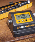 Torque Tester Bench Top Half Inch Drive 10 To 100 Foot Pounds 13.6 To 135.6 Newton Meters Four Readouts Inch Pounds Foot Pounds Newton Meters And Kilogram Centimeters Accuracy Plus Or Minus One Percent Model 89633 digital torque tester on workbench