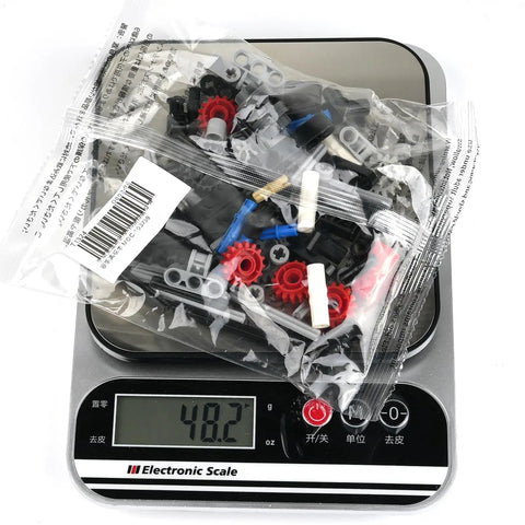 4 Speed Manual Transmission Model Kit For Hands On Learning DIY Gearbox Build Set STEM Engineering Toy, parts on digital scale