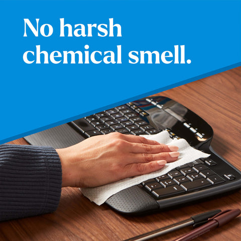 Hand cleaning keyboard with EcoClean Disinfecting Wipes Multipurpose Plant Based Formula That Kills 99.9 Percent Of Germs In Minutes