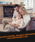 Family reading together by the fireplace on a cozy living room sofa.