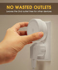 Hand plugging in Two Pack Plug In LED Night Lights With Sensor Auto On At Dusk Kid Friendly For Nursery And Home into wall outlet