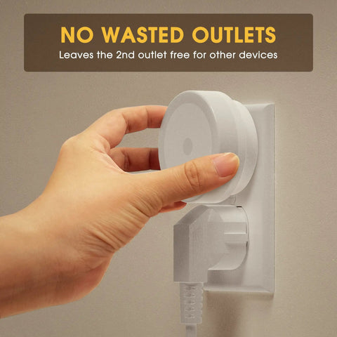 Hand plugging in Two Pack Plug In LED Night Lights With Sensor Auto On At Dusk Kid Friendly For Nursery And Home into wall outlet