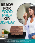 Wood cutting board with circular engraving on a display stand on a kitchen counter