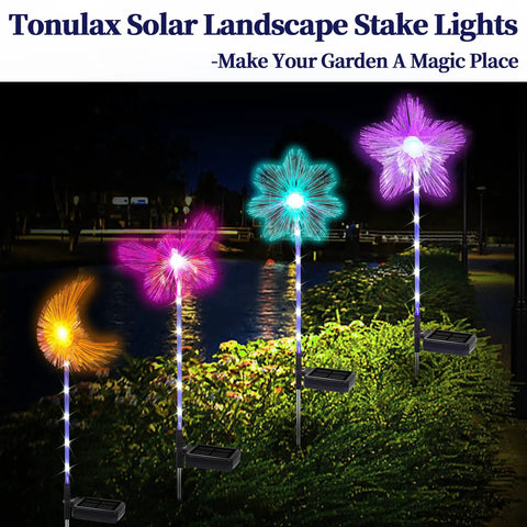 Solar Garden Stake Lights 4 Pack With RGB Color Changing LEDs for pathways and outdoor living, glowing at night with colorful designs.