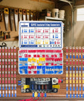 Ultimate 150 Piece Crimp Connector Kit with 16 types of electrical connectors in assorted colors in a workshop setting.