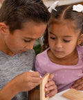 Children assembling the Wooden Bird House Kit For Kids To Build And Paint A Fun Diy Arts And Crafts Project Ages 5 12 Includes Pre Cut Parts Nails Glue Paintbrush Perch Hooks Chain And Easy Instructions For A Totally Creative Weekend Activity.