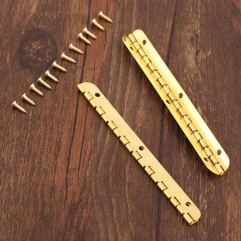 Antique Bronze Decorative Hinges for Wooden Boxes and Cabinets 2 Pack Butt Hinges 100mm by 9mm with screws on wood surface